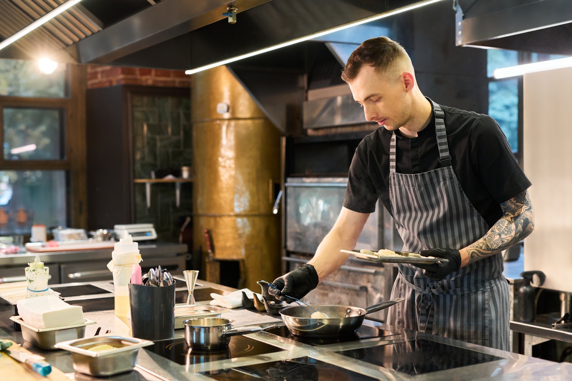 Line cook preparing food in commercial kitchen